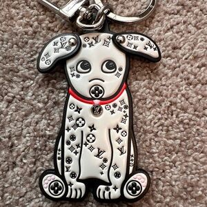 Louis Vuitton key holder and/or bag charm.